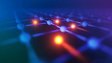 Farbliche Illustration mehrerer Elektronen in einer Anordnung mit Lichtpunkten auf dunklem Hintergrund.